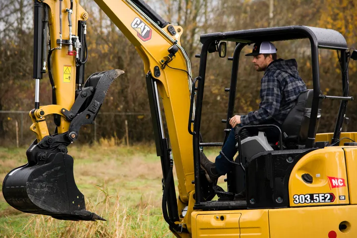 Corey Davison in the seat of a Cat 303.5 mini excavator